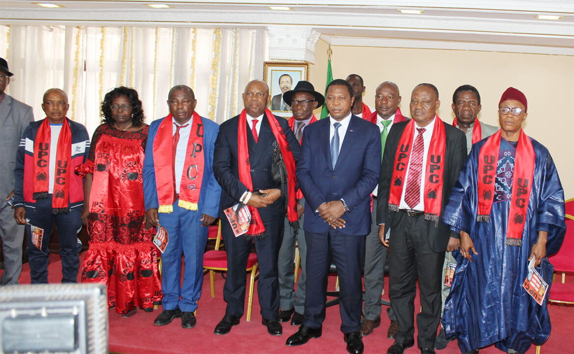UPC militants pose for a family picture with Minister Paul Atanga Nji