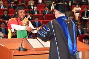 Ngoran Aristide Tahtinnyuy, receiving award and distinction