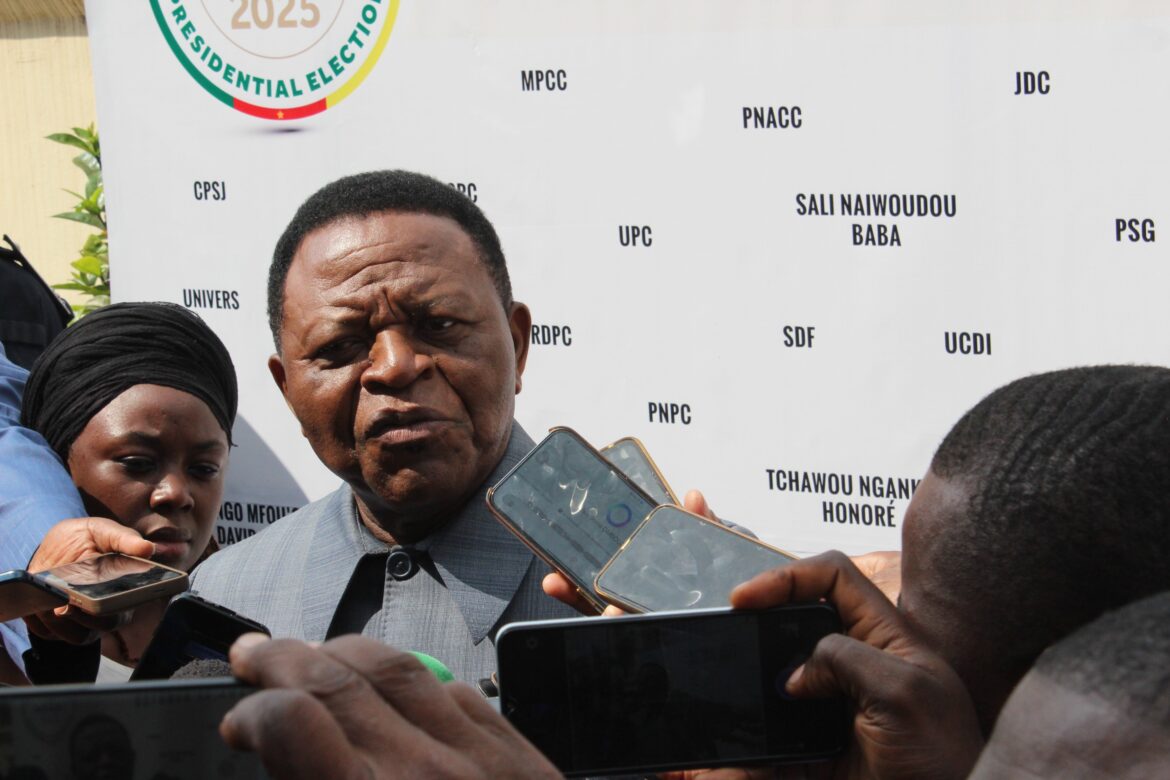 Dr. erik essousse, director general of elections at elecam presenting the media center to the press