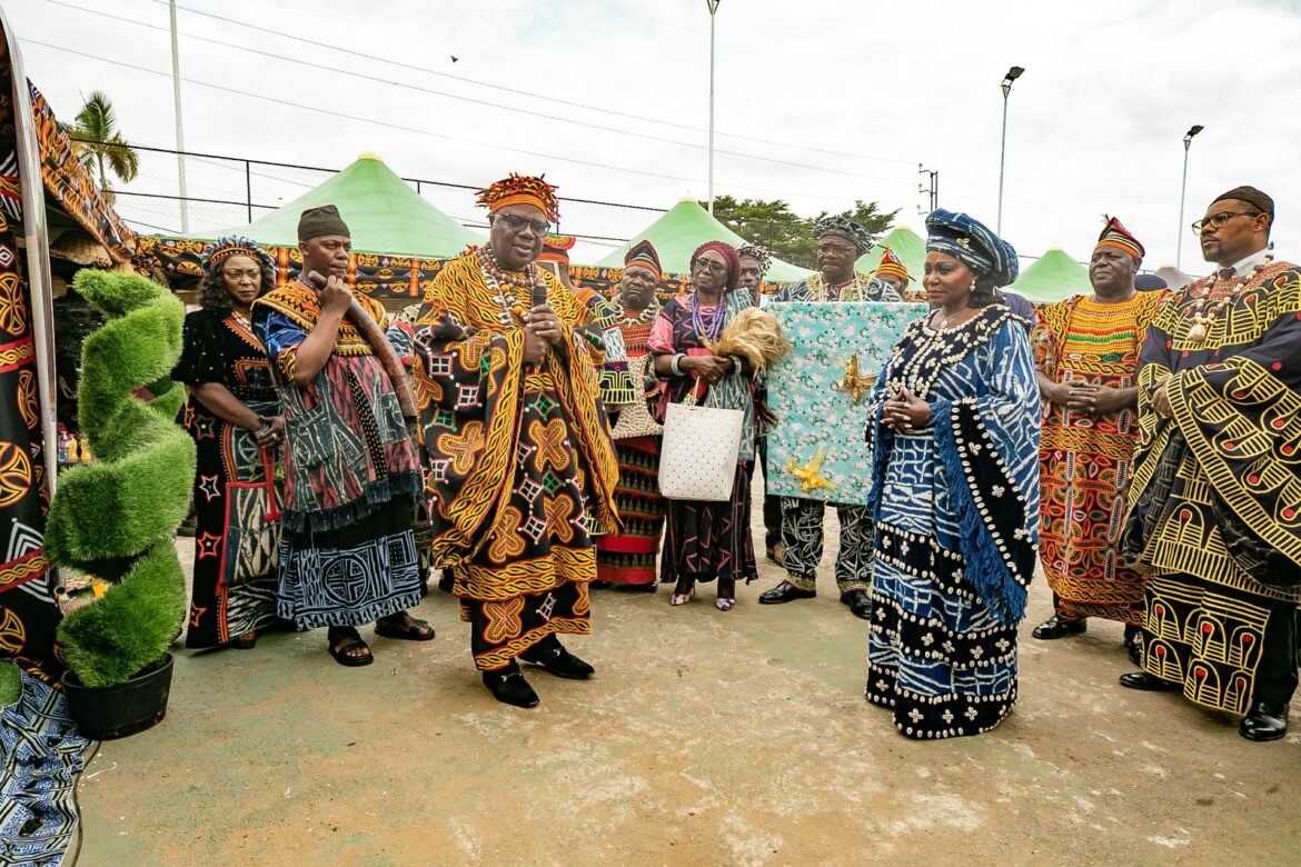 Judith yah sunday Épse achidi (in blue) standing in the midst of traditional authorities
