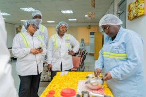 Journalists at the Nestle factory observing the production process of Maggi