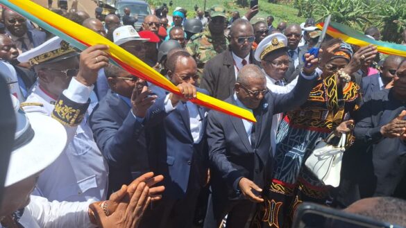 PM Dion Ngute and officials cutting ribbon to officially open road