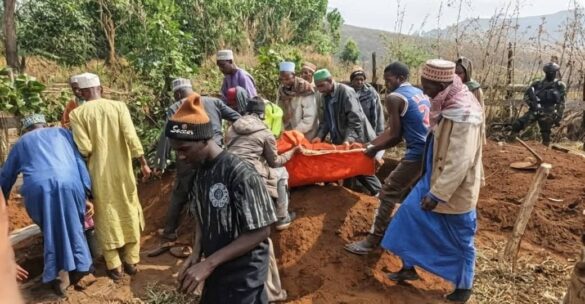 Locals burying victims of the Gidado massacre