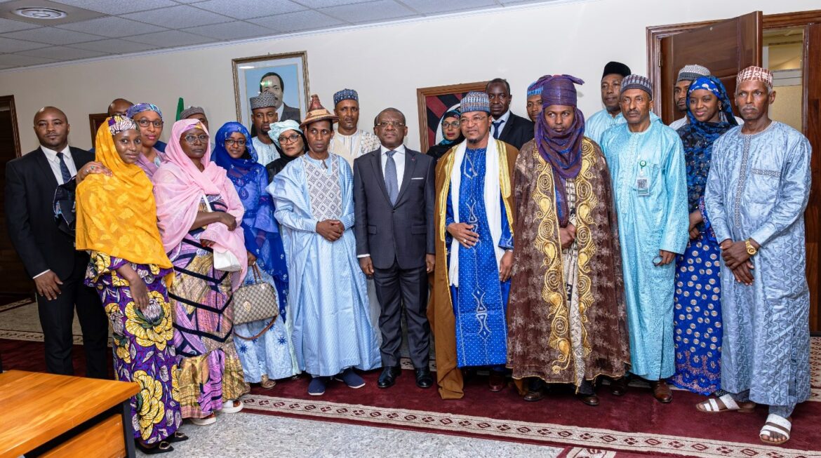 MBOSCUDA delegation members in group photo with the PM after the meeting