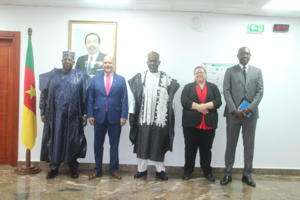 Minister Ousmane Mey, Ambassador Lamora and officials pose for a family picture