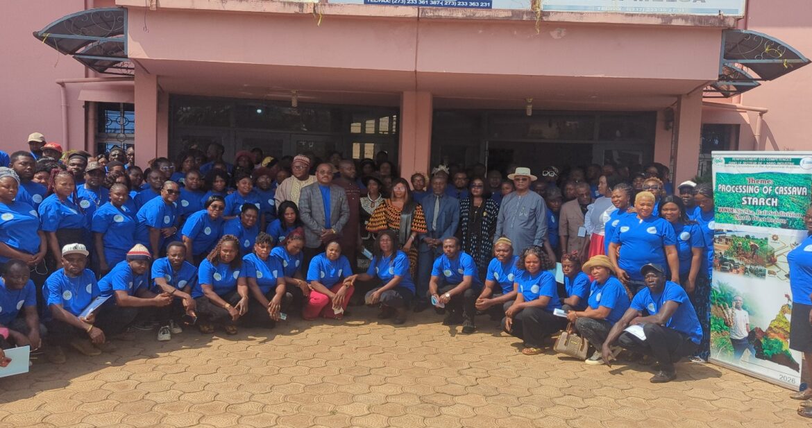 Trainees in a family photo with the trainers and administration