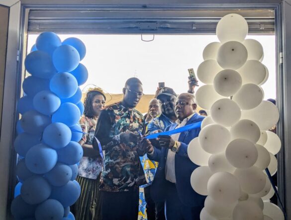 DO's representative, BAFCCUL Board President and GM cut ribbon to launch Limbe branch office