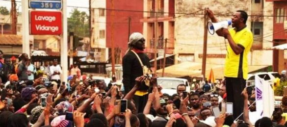 Mancho Bibixy (with megaphone) addressing fellow protesters in 2016